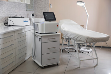 Laser hair removal machine and medical couch in beauty salon