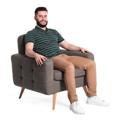 Fototapeta premium Smiling man relaxing on armchair against white background
