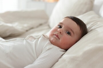 Obraz premium Bedtime. Cute little baby on bed at home