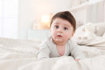 Bedtime. Cute little baby on bed at home