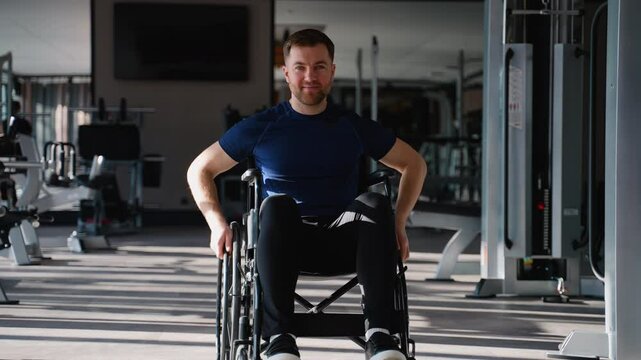 Confident man in a wheelchair moves independently through modern gym, representing mobility, strength, and an active adaptive lifestyle