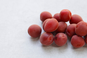 Umeboshi, Japanese pickled plums, Sour and salty taste.