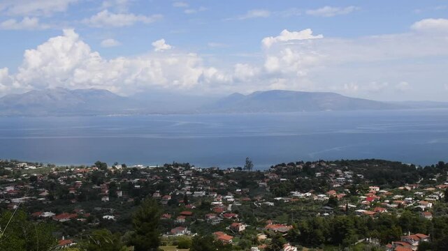 Experience the serene beauty of Agii Apostoli in Greece with panoramic views of the coastline and mountains. View from above to landscape showcases the charm of Greek nature.