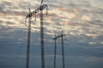 a large electricity pole at dusk