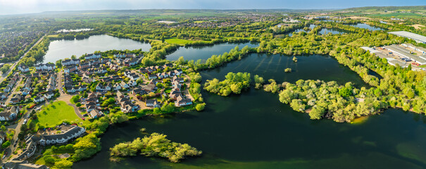 Aerial drone view of .Leybourne Lakes and housing estate, Aylesford, Kent, England