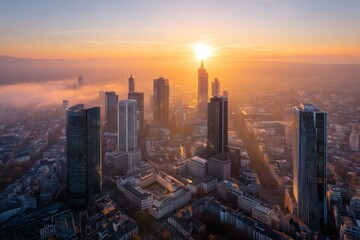 Fototapeta premium A stunning cityscape at sunrise, capturing the golden hues of the morning sky with silhouettes of skyscrapers and buildings