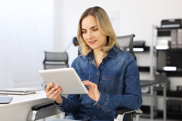 Professional engineer working with tablet in office
