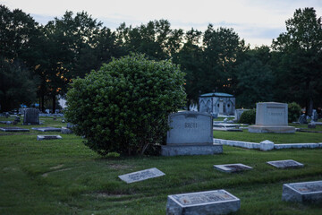 Gravestones in a cemetery in the evening