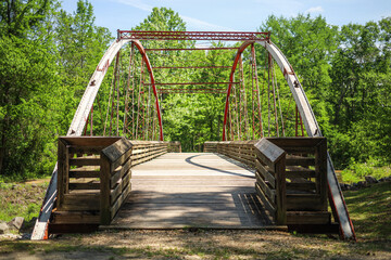 Big wooden and metal bridge in the park