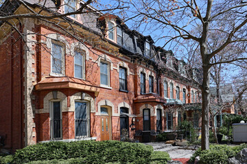 Fototapeta premium Row of well preserved 19th century houses with dormer windows and mansard roof