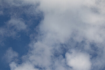 Background Texture of White clouds against a blue sky.
