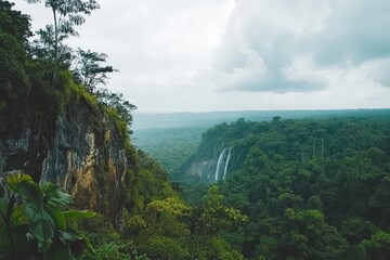 Angel Falls Waterfall Cascading from Cliff into Lush Tropical Jungle Under Cloudy Sky