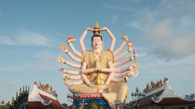 Colorful statue of Guanyin, the Goddess of Mercy and Compassion in East Asian Buddhism with eighteen arms in Wat Plai Laem temple on Koh Samui island in Thailand. Travel and touristic landmark