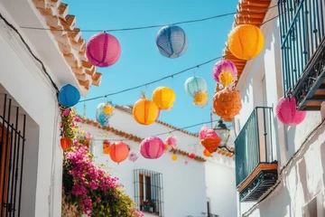 Colorful Paper Lanterns Hanging in a Spanish Village Alley During Festival