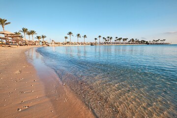 Hurghada, Egypt - January 03, 2024: Crystal clear water of Red Sea in front of a Bel Air Azur Resort Hotel