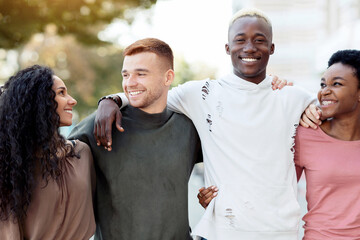 International group of friends in casual outfits smiling and hugging on the street, carefree multiracial students standing in a row and embracing outdoors, having conversation, closeup, panorama