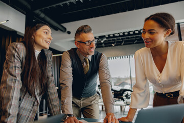 A group of professionals engaged in a highly productive and effective discussion within a...