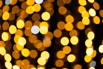 Golden bokeh lights for festive and event background design.