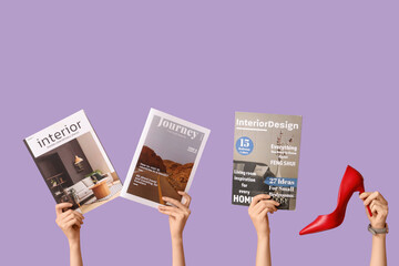 Female hands with different magazines and high heel on lilac background