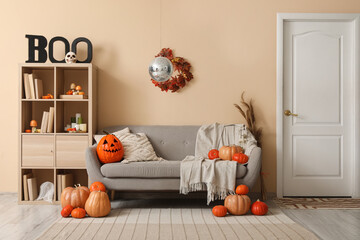 Stylish living room with disco ball and soft sofa decorated for Halloween party