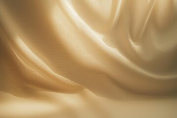 Fototapeta premium soft flowing beige fabric with smooth folds and gentle light reflections creating a calm and warm atmosphere