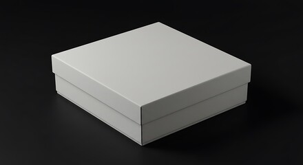 Fototapeta premium A simple white square box on a black background, perfect for product packaging, design mockups, or gift presentation.