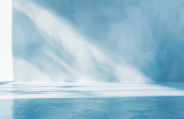 Fototapeta premium Empty bright room with textured light blue walls and shiny blue tiled floor illuminated by soft sunlight casting gentle shadows, evoking calm and tranquility