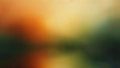 Obraz premium blurred landscape with warm orange and yellow tones blending into dark green and blue hues creating a soft and calm atmosphere