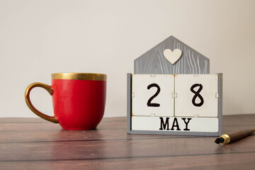28 May text on wooden blocks with customizable space for text or messages.
