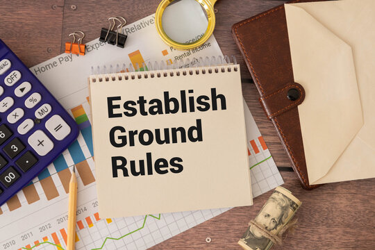 Text ESTABLISH GROUND RULES on brown paper notepad.