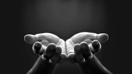 Close-up of two cupped hands held together with palms facing up in soft monochrome lighting evoking a sense of offering and vulnerability