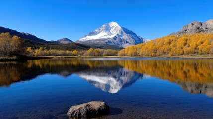 Serene mountain lake reflecting autumnal hues.  Tranquil alpine vista
