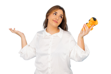 Young businesswoman holding a small toy and shrugging, showing uncertainty and confusion, on a transparent background