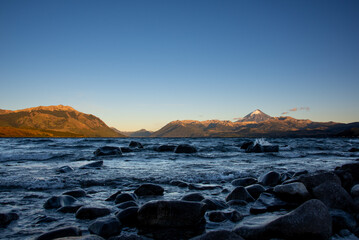 Sunrise at lago huechulafquen and peak of lanin volcano at lanin national park, patagonia, argentina