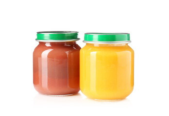 Baby food. Tasty puree in glass jars isolated on white