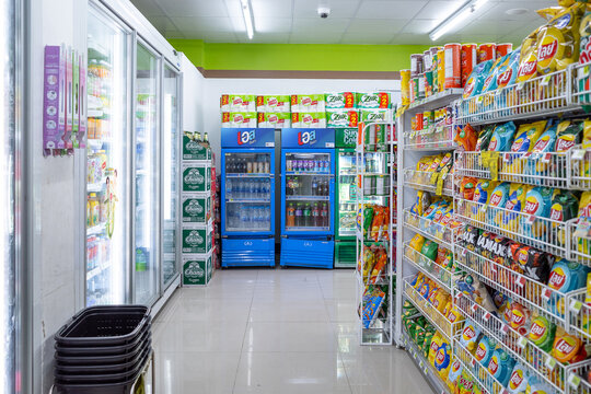Bangkok, Thailand - March 17 2025 : Interior of a brightly lit convenience store selling various food and drinks at Bangkok, Thailand