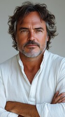 Fototapeta premium Portrait of a Man with Curly Hair and a White Shirt