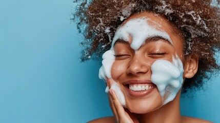 Happy woman enjoying face foam cleansing
