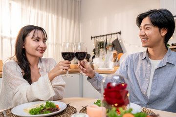 Asian young couple having dinner to celebrate valentine's day together. 