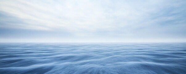 Obraz premium Tranquil expanse of a misty, still water surface