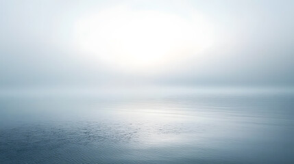 Obraz premium Serene Ocean Horizon: A tranquil expanse of ocean blends seamlessly with the ethereal sky, enveloped in a soft, hazy atmosphere, creating a sense of calm and boundless serenity.