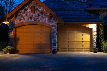 Garage door in luxury house with trees and nice landscape in Spring in Vancouver, Canada, North...