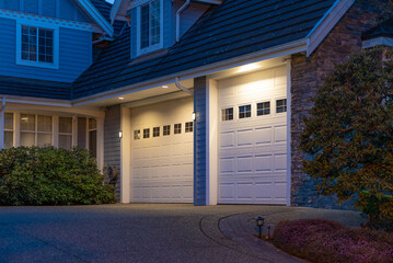 Garage door in luxury house with trees and nice landscape in Spring in Vancouver, Canada, North...