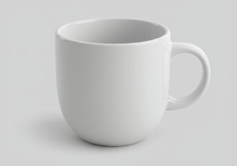 Fototapeta premium A simple white ceramic mug with a handle on a plain white background in a studio setting light