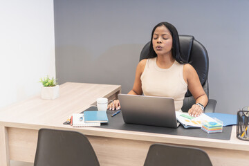 Manager practicing mindfulness meditation at work for work-life balance
