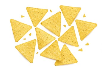 An overhead shot of several yellow tortilla chips scattered on a plain white surface in a studio setting