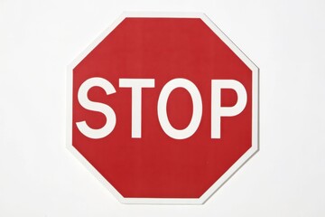 A red octagonal stop sign with white lettering displayed against a plain white background.