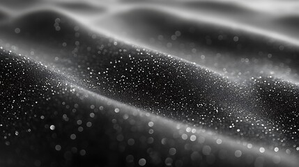 Dark, textured surface with shimmering droplets