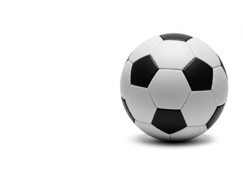 Fototapeta premium A soccer ball with black pentagons and white hexagons on a white background in studio lighting