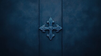 Naklejka premium Ornate metallic cross on a dark blue textured background, centered and symbolizing faith or spirituality.